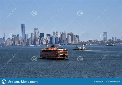 Ferry Ship Sailing Through The New York Bay Nyc Skyline On The
