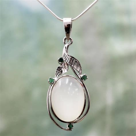 Emerald Guards The Mystical Glow Of Moonstone In A Fascinating Design