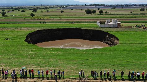 Giant Sinkhole Opens In Field In Mexico Threatens To Swallow Nearby