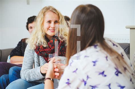 Friends In Conversation At Youth Group — Photo — Lightstock