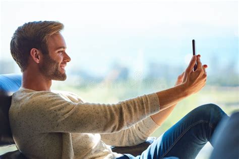 Attractive Caucasian Man Taking A Selfie With His Mobile Phone Stock