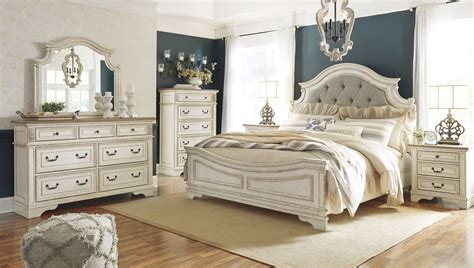Realyn Chipped Two Tone Upholstered Panel Bedroom Set From Ashley Coleman Furniture