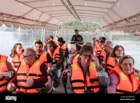 Tourists Wearing Orange Life Jackets Are Taken From Their Cruise Ship