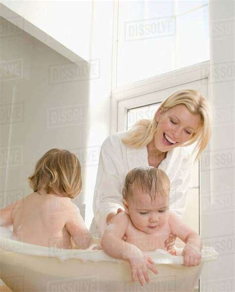 A Mum Bathing Her Babies Stock Photo Dissolve