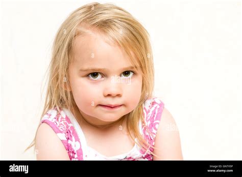Closeup Headshot Portrait Of Beautiful Toddler Girl With Mischievous
