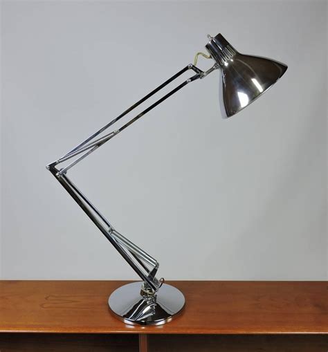 A damp paper towel worked great to clean most of the lamp, but where the price tag sticker was needed a little extra work. Luxo L-1 Articulated Chrome Desk Task Lamp For Sale at 1stdibs