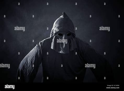 Scary Figure In Hooded Cloak Stock Photo Alamy