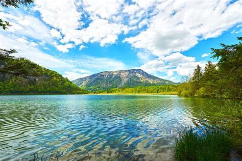 Beautiful Offensee Lake Landscape With Mountains Forest Clouds And
