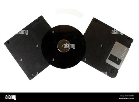 A Set Of Floppy Disks With An Open Magnetic Disc In Between Which Is