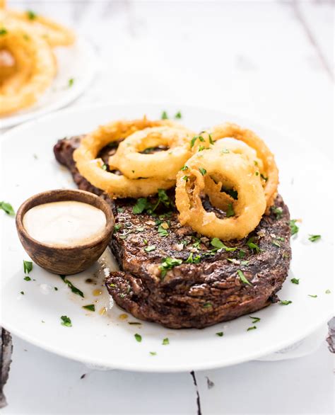 Chili Rubbed Ribeye Steak With Beer Battered Onion Rings
