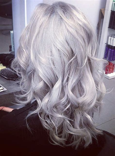 The hair is bleached in platinum white color matching the skin tone and the hair on the top is given a height and styled with a quiff. Silver Grey & Platinum Blonde Hair, Hair Salon, Egham