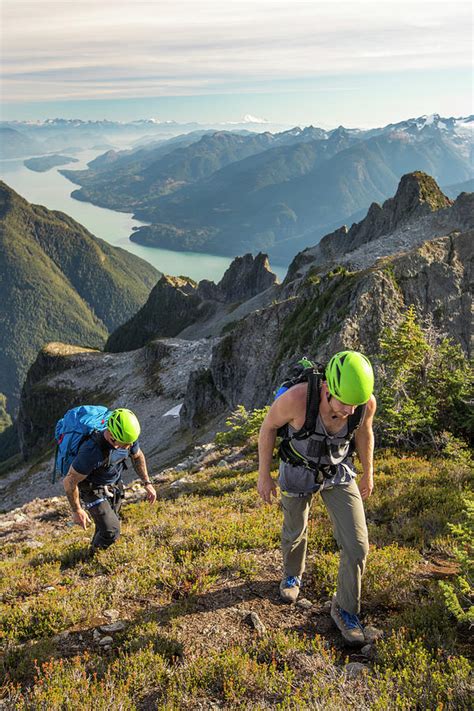 Two Climbers Approach The Summit Of Douglas Peak British Columbia