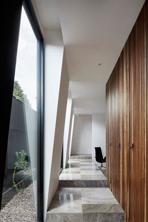 A House Divided In Two Buildings Separated By A Central Courtyard And