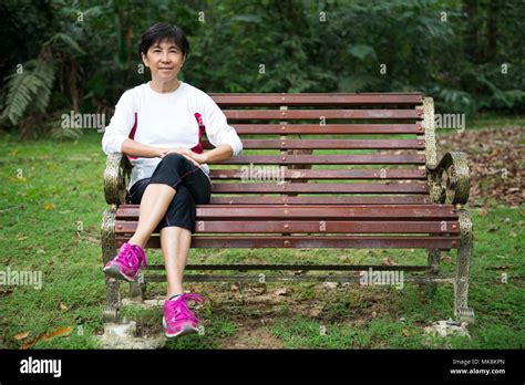 Mature Woman On Park Bench Hi Res Stock Photography And Images Alamy