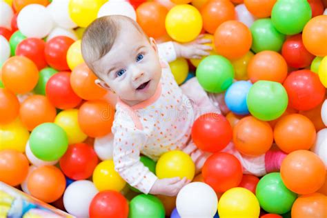 Baby Girl Playing With Colorful Balls Stock Image Image Of Adorable