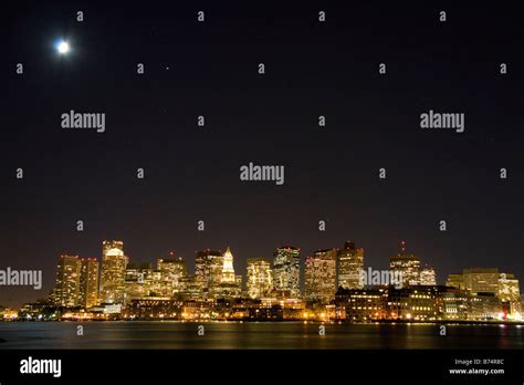 Boston Skyline On A Moonlight Starry Night With Boston Harbor In The