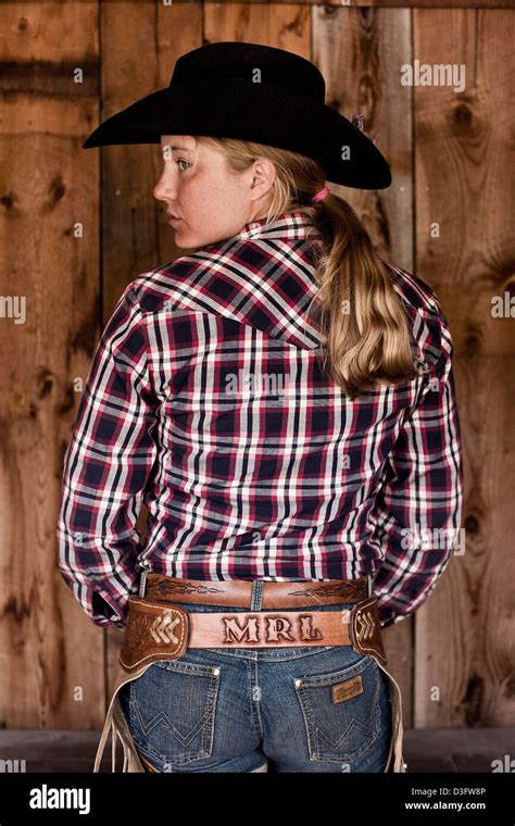 Cowgirl Wrangler Standing With Checked Shirt Rear View Montana Usa Stock Photo Alamy