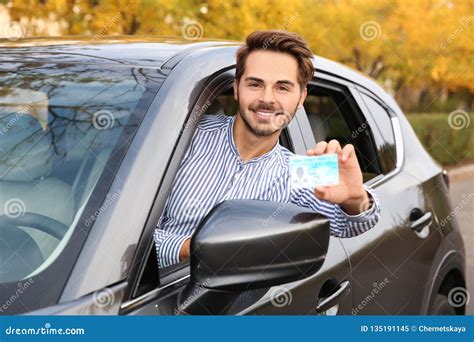 Young Man Holding Driving License Stock Image Image Of Road Happy