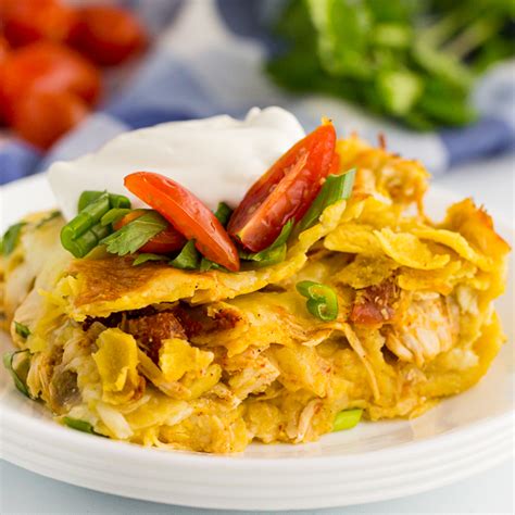 We love a good casserole and this chicken enchilada casserole recipe certainly doesn't disappoint. Easy Chicken Enchilada Casserole Recipe - Freezer friendly!