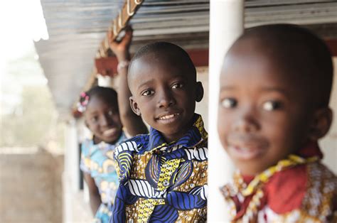 Three African Children Smiling And Laughing Outdoors Stock Photo
