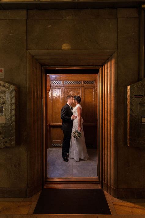 the kissing elevator booth southern california wedding photographer… wedding portraits