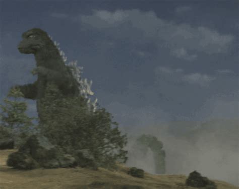 A Large Dinosaur Standing On Top Of A Hill