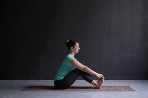 Premium Photo Woman Practicing Yoga Doing Seated Forward Bend Pose
