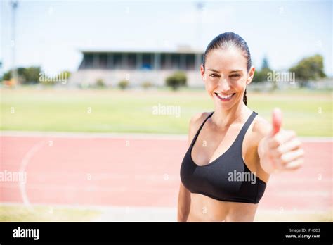 Portrait Of Female Athlete Showing Her Thumbs Up Stock Photo Alamy