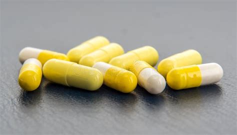 Capsules Containing Medicine And Their Contents Are Visible Stock Photo