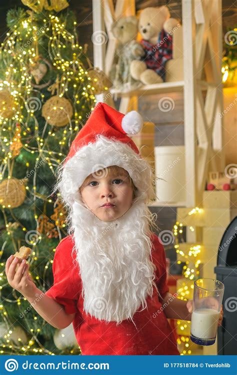 Santa Claus Eating Cookies And Drinking Milk On Christmas Eve Kid