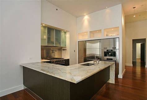 Suited for kitchen or bath. Contemporary Kitchen with Stainless steel backsplash, High ...