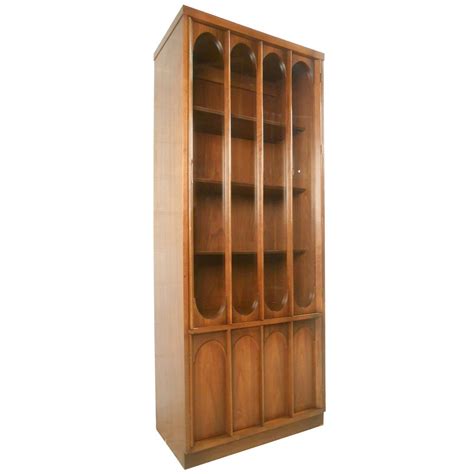 The lighted corner curio cabinet uniquely comes in two stackable pieces to enrich its overall quality and structural appearance. Mid-Century Modern Broyhill Brasilia Curio Display Cabinet ...