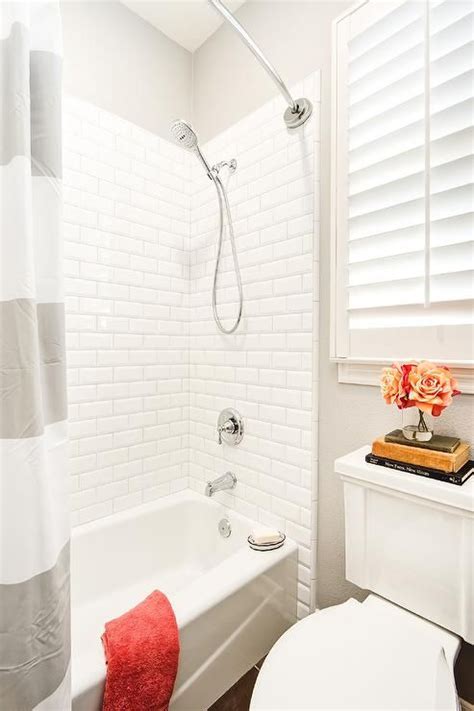 A shower dam divides the shower from the bathroom flooring to keep water contained and allows for two different flooring materials, but removing it and long, skinny tiles.as a variation on the classic subway tile, elongated rectangular tiles are an edgier and more modern take on the traditional style. Gray and white kids bathroom boasts a bathtub fitted with ...