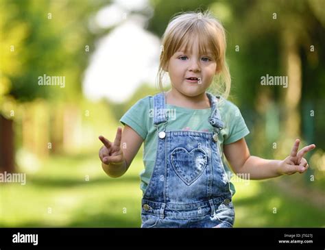 Little Girl In Park Stock Photo Alamy