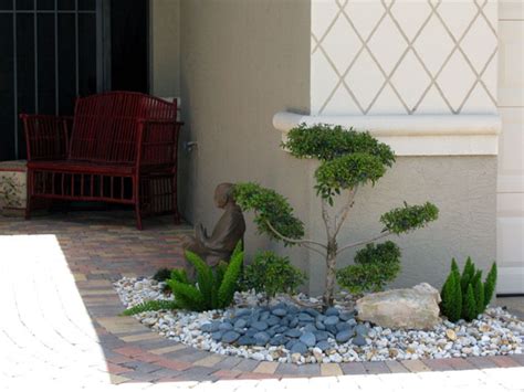 You can also consider utilizing other decorative products in your front garden in order to maximize the level of attraction of your front small garden. Garden Design Ideas With Pebbles