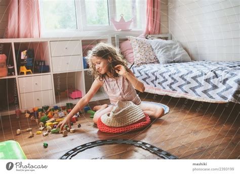 Child Girl Cleaning Her Room A Royalty Free Stock Photo From Photocase