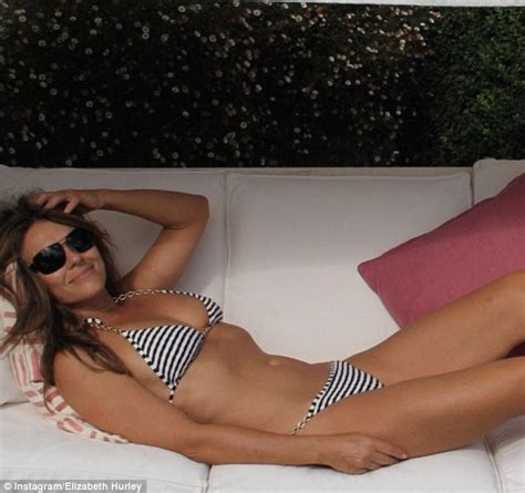 Elizabeth Hurley Shows Off Her Jaw Dropping Figure In A Navy And White