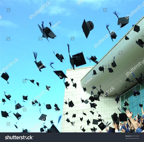 Graduation hats in the air. Graduation - Flying Hats In The Air Stock Photo 79714387 ...
