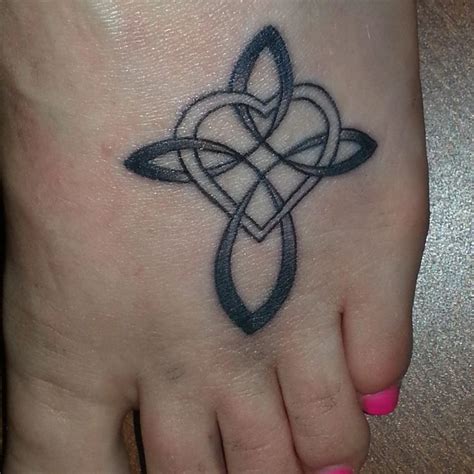 This tattoo is very neatly done on the wrist, which is a great placement idea for such a design. foot tattoo - infinity cross | Things That I Like! | Pinterest