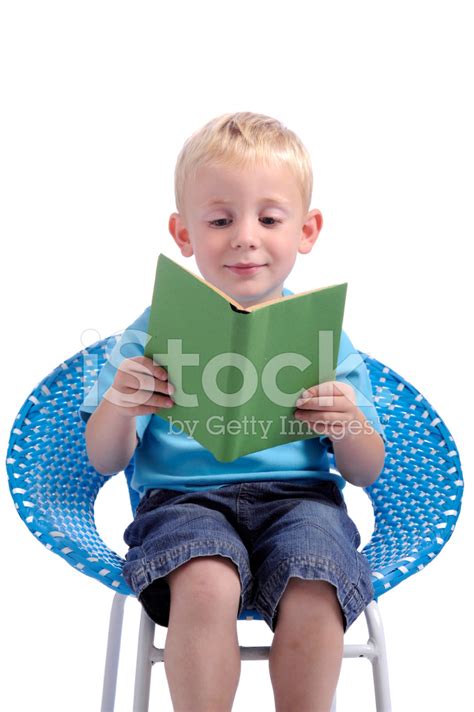 Little Boy Reading A Book Stock Photo Royalty Free Freeimages