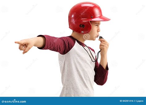 Boy In Sportswear Blowing Whistle And Pointing With His Hand Stock