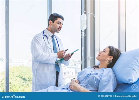 Doctor Check Up And Report Examination For Woman Patient At Hospital Or Medical Clinic Stock