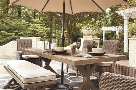 By stylewell (111) black metal outdoor side table with umbrella hole. Beachcroft Dining Table with Umbrella Option | Ashley ...