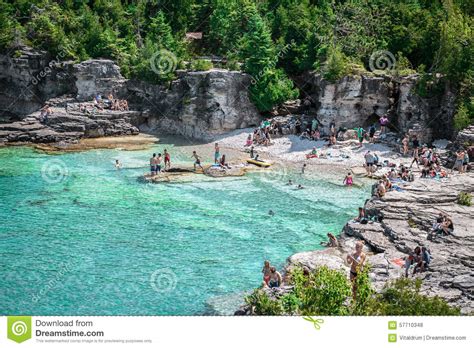 Amazing Natural Rocky Beach And Tranquil Azure Clear Water With People