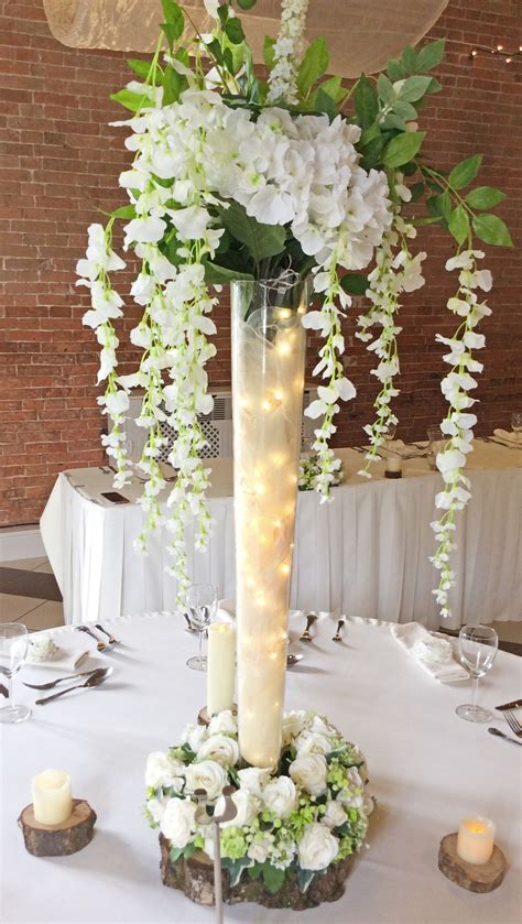 Tall Vase With Wisteria And Lights Wedding Floral