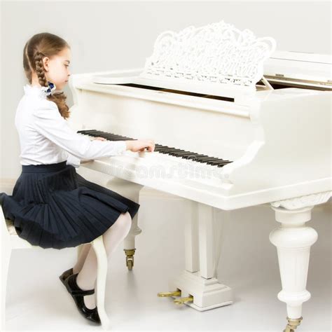 A Girl From A Music School Plays The Piano Stock Photo Image Of
