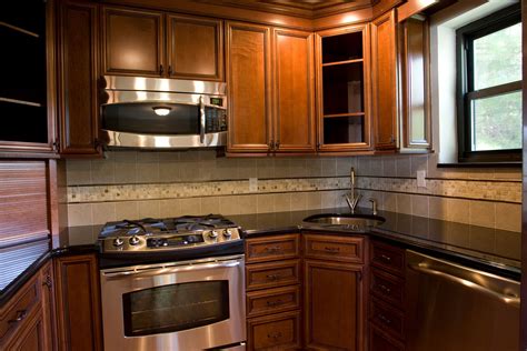 We explore what is mdf and compare with wood on costs, durability and staining. Kitchen by Color-Age, Armstrong Cabinets: Serenity Mocha Brown Glaze, Absolute Black Granite ...