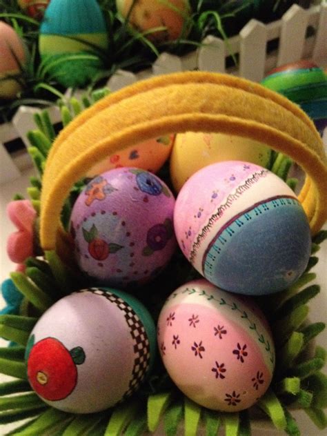 An Arrangement Of Painted Eggs In A Basket
