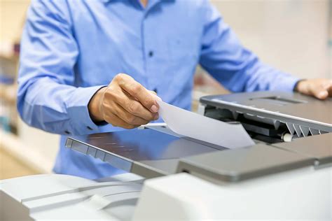 Businessmen Put The Papers On The Copier For Copy And Scanning