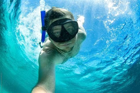 Holding Breath While Diving Underwater By Stocksy Contributor Robert Lang Stocksy